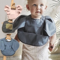 Cute Nordic Style Baby Bib with Angel Feed Pocket, Waterproof and Easy to Clean, Soft and Durable PU Material, Perfect for Infant Meals, Available in Elephant Design for Boys and Girls.